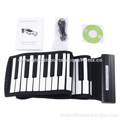 Some one play a folding roll up piano for learning